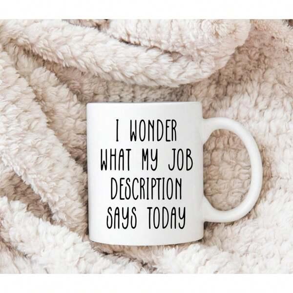 Tailorly White Ceramic 11 oz Mug - I Wonder What My Job Description Says Today Resting On A Soft Textured Beige Fuzzy Woolen Material Ceramic Mug