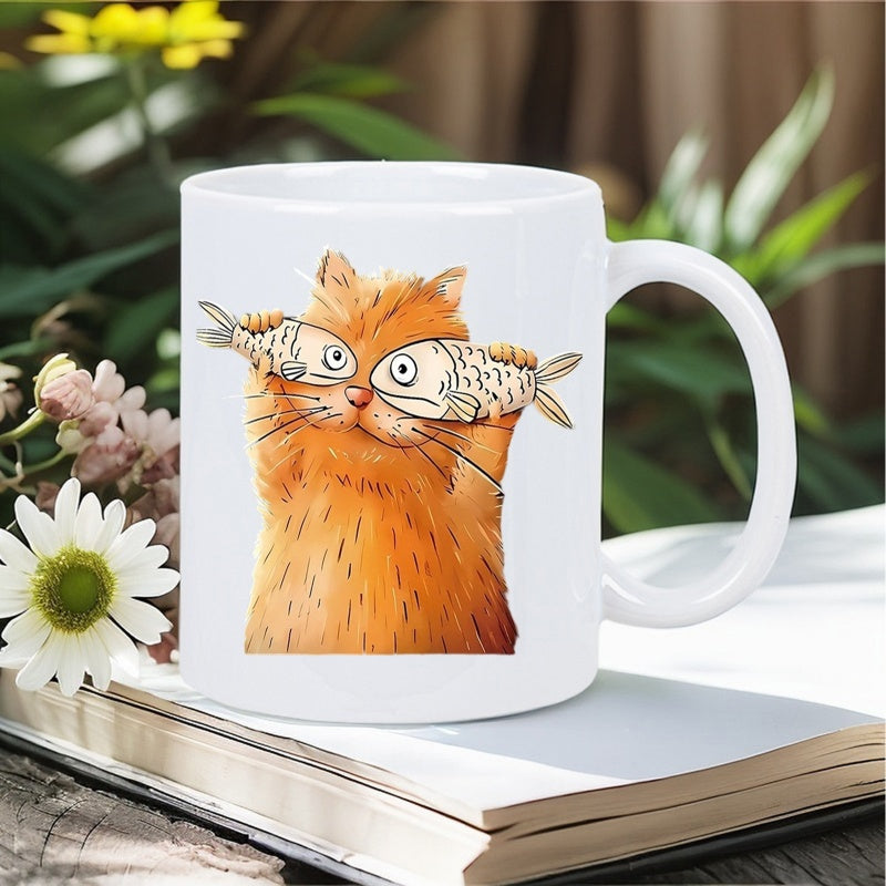 Tailorly White Ceramic 11 oz Mug - Whimsical Orange Cat Holding Two Fish Over Eyes In Playful Pose Cat