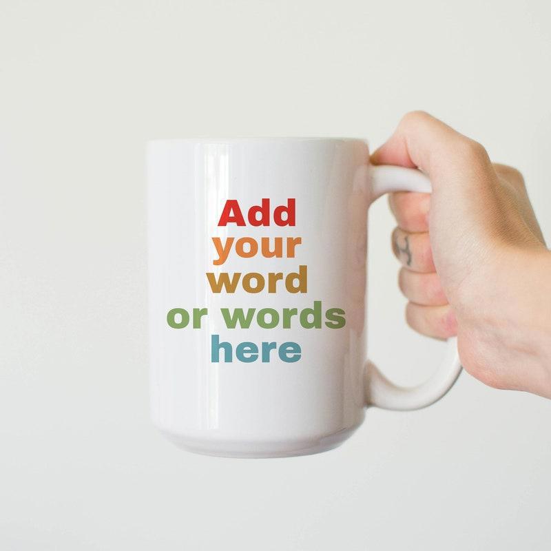 Tailorly White Ceramic 11 oz Mug - Add Your Word Or Words Here Simple White Ceramic Cup Held By Hand Against Neutral Background Mug