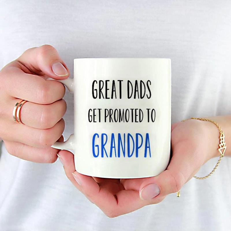 Tailorly White Ceramic 11 oz Mug - Great Dads Get Promoted To Grandpa Classic Minimalist Ceramic Vessel Held By Human Hands Wearing Jewelry Mug