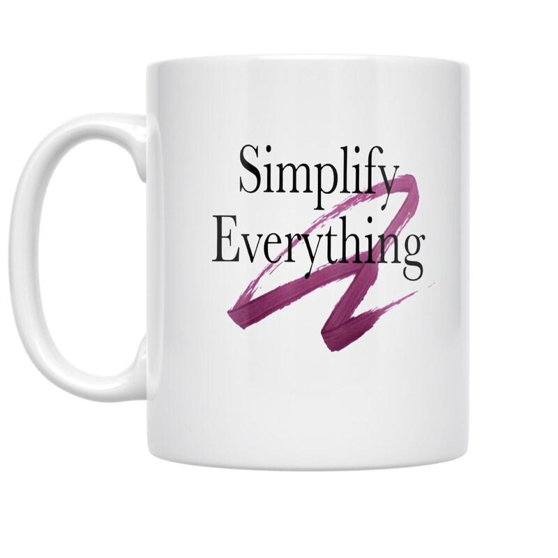 Tailorly White Ceramic 11 oz Mug - Simplify Everything Purple Artistic Brushstroke Design Behind Modern Black Serif Mug