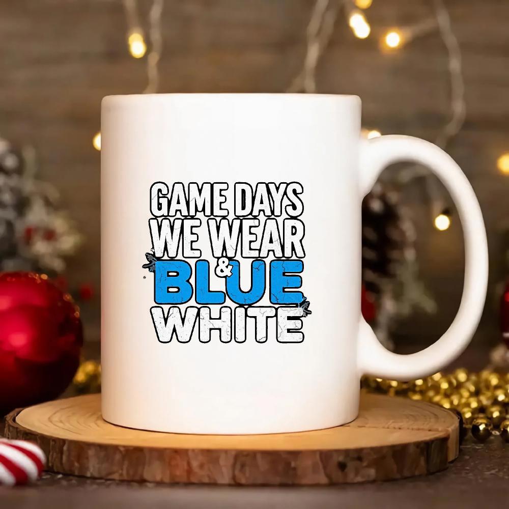 Tailorly White Ceramic 11 oz Mug - Game Days We Wear Blue White Classic Ceramic Vessel Resting On A Rustic Wooden Base Mug