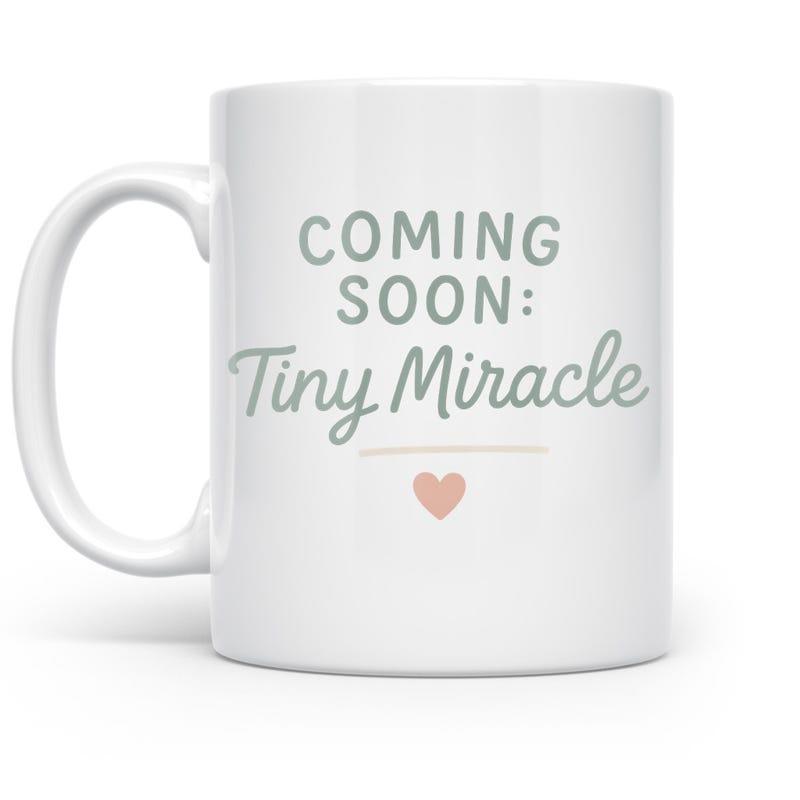 Tailorly White Ceramic 11 oz Mug - Coming Soon Tiny Miracle Minimalist Pink Heart Floating Under Elegant Script Heart