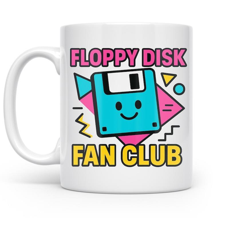 Tailorly White Ceramic 11 oz Mug - Floppy Disk Fan Club Cute Cartoon Storage Device Surrounded By Vibrant Geometric Retro Memphis Shapes Floppy Disk