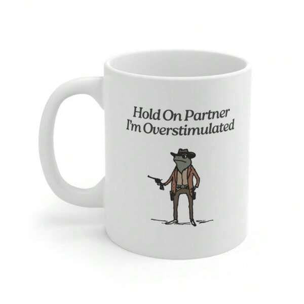 Tailorly White Ceramic 11 oz Mug - Hold On Partner I'm Overstimulated Funny Cartoon Cowboy Frog Wearing Hat Holding Pistol In Western Style Frog