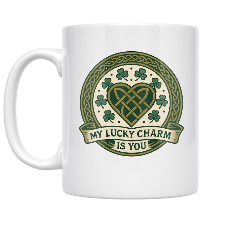 Tailorly White Ceramic 11 oz Mug - My Lucky Charm Is You Traditional Celtic Knotwork Heart With Many Green Clovers Inside Circular Emblem