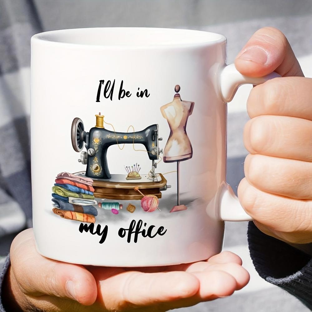 Tailorly White Ceramic 11 oz Mug - I'll Be In My Office Vintage Manual Black Tailor Mannequin Beside Colorful Fabric Stacks Sewing Machine