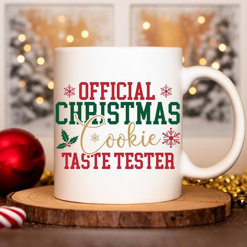 Tailorly White Ceramic 11 oz Mug - Official Christmas Cookie Taste Tester Festive Red Snowflakes Among Green Holly Leaves And Berries On Ceramic Mug