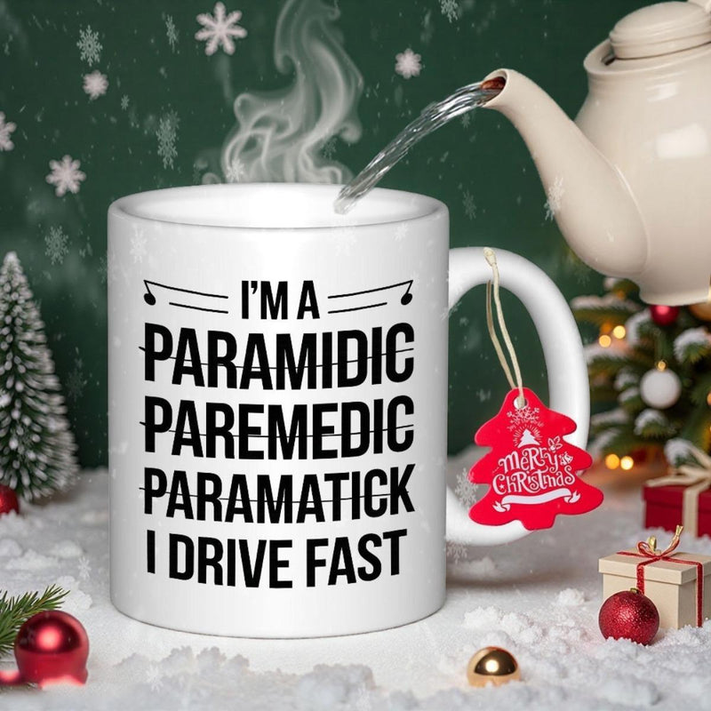 Tailorly White Ceramic 11 oz Mug - I'm A Paramidic Paremedic Paramatick I Drive Fast Sleek White Ceramic Coffee Cup Resting On Snow With Festive Holiday