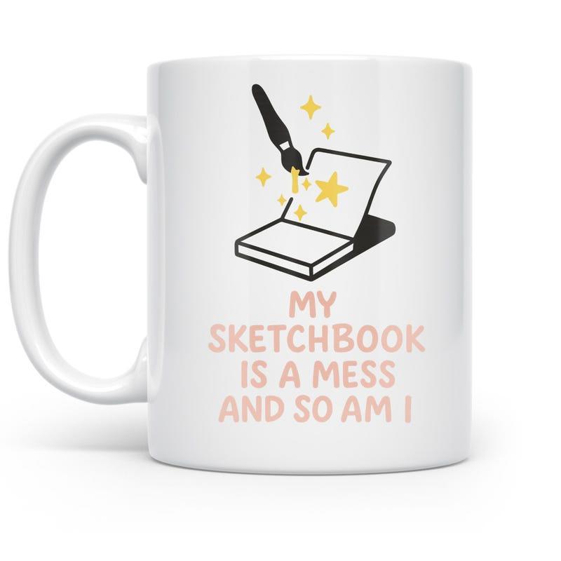 Tailorly White Ceramic 11 oz Mug - My Sketchbook Is A Mess And So Am I Minimalist Black Paintbrush Creating Magic Stars Over Open Sketchbook