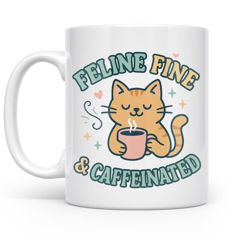 Tailorly White Ceramic 11 oz Mug - Feline Fine Caffeinated Adorable Orange Tabby Holding Steaming Coffee Cup Surrounded By Hearts And Stars Cat