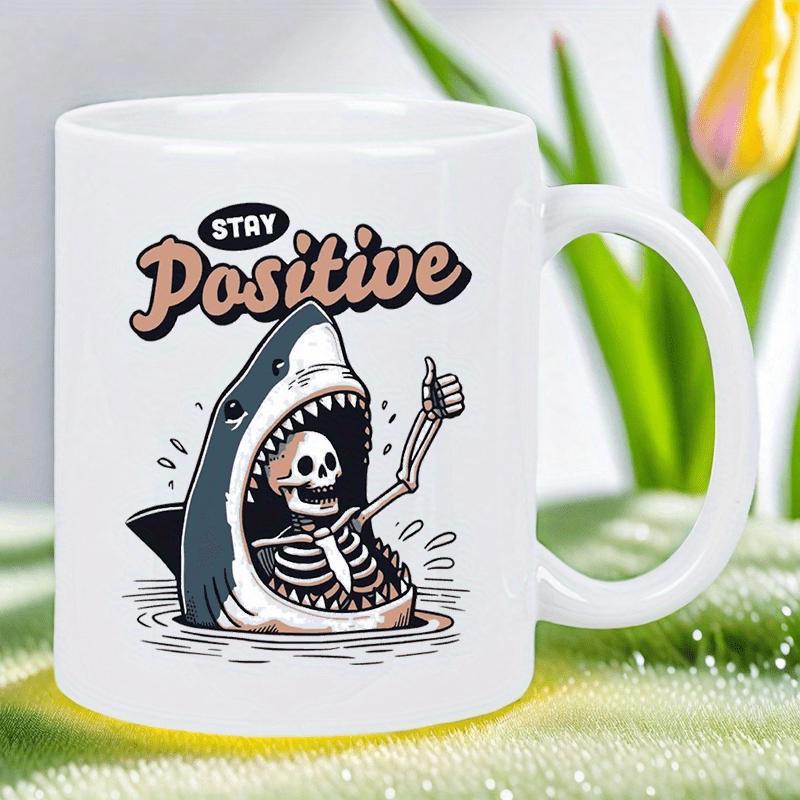 Tailorly White Ceramic 11 oz Mug - Stay Positive Funny Cartoon Shark Rising From Waves With A Skeleton Giving Thumbs Up Shark