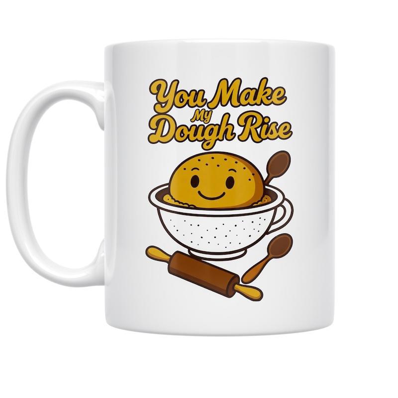 Tailorly White Ceramic 11 oz Mug - You Make My Dough Rise Smiling Cartoon Character Inside Mixing Bowl With Spoons And Rolling Pin Dough