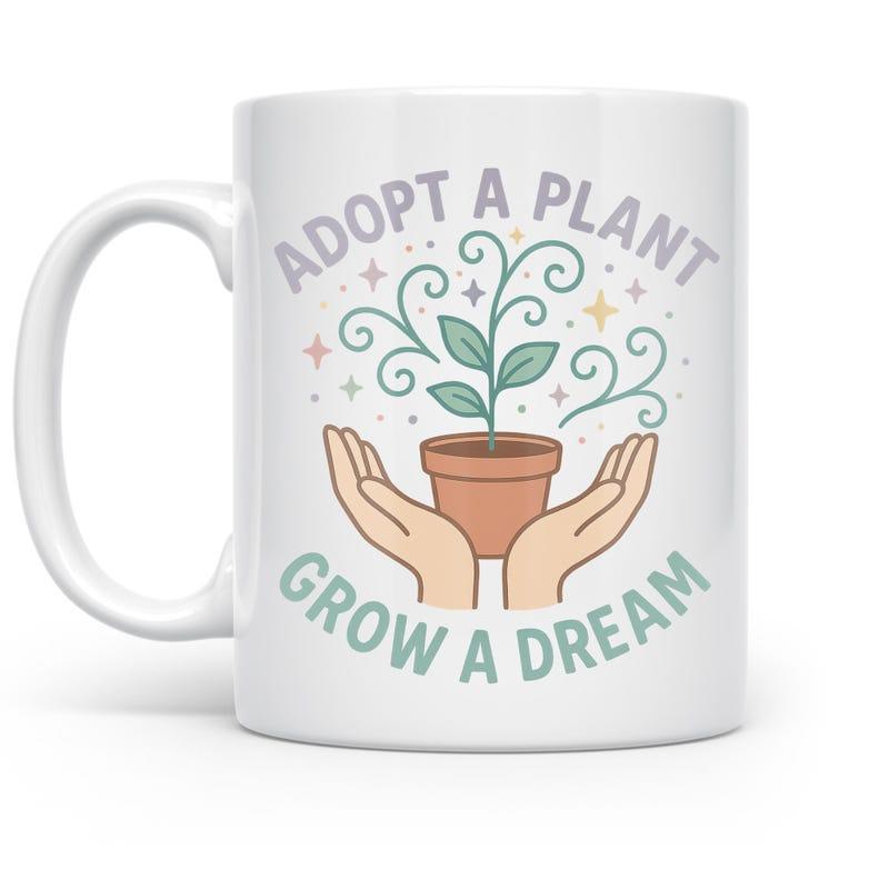 Tailorly White Ceramic 11 oz Mug - Adopt A Plant Grow A Dream Two Hands Gently Holding A Potted Sprout With Elegant Swirling Vine Details Plant