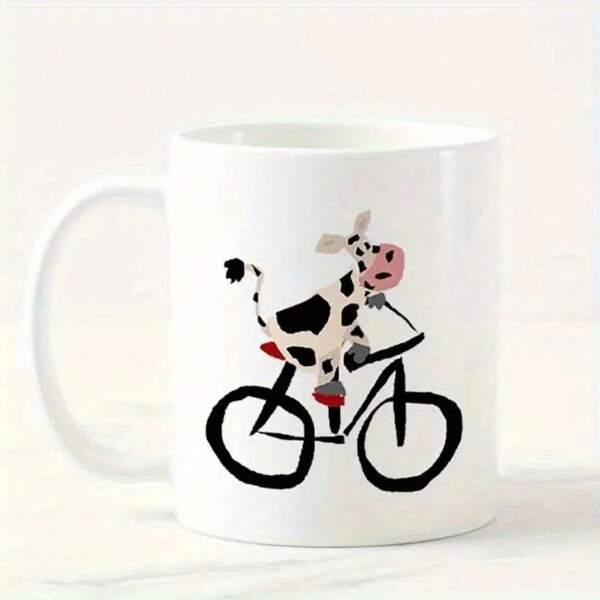 Tailorly White Ceramic 11 oz Mug - Playful Cartoon Spotted Animal Riding A Minimalist Black Frame Mountain Bicycle Cow