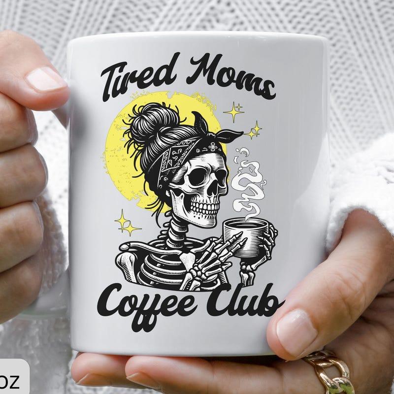 Tailorly White Ceramic 11 oz Mug - Tired Moms Coffee Club Artistic Figure With Messy Bun Holding Steaming Cup Of Morning Skeleton