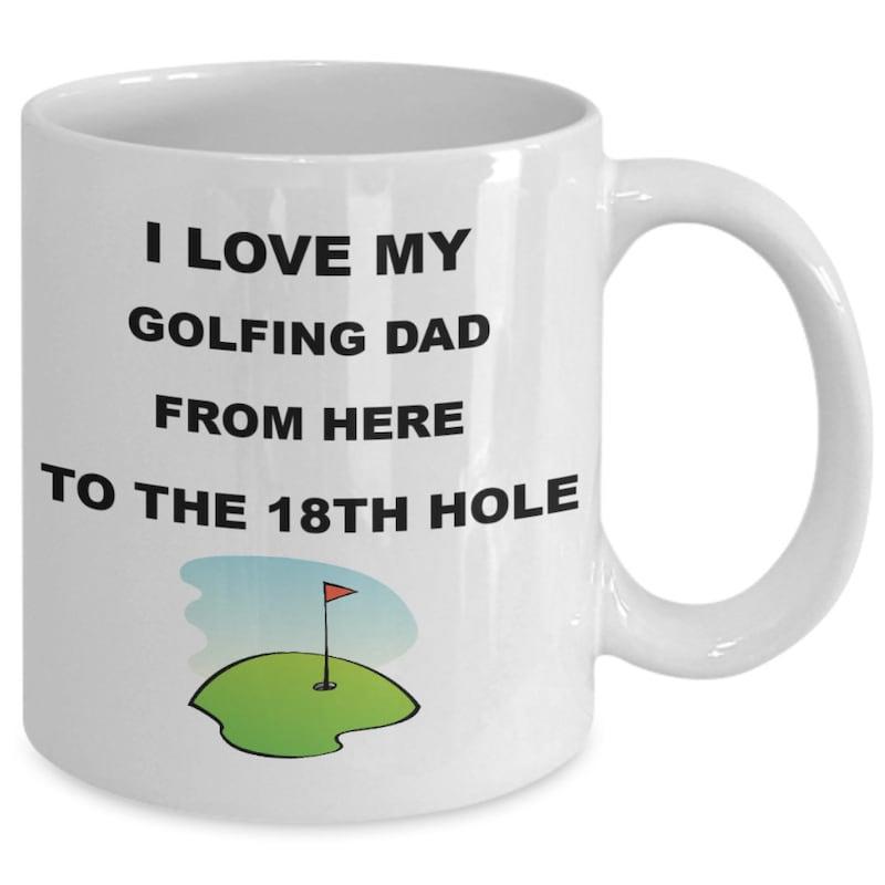 Tailorly White Ceramic 11 oz Mug - I Love My Golfing Dad From Here To The 18th Hole Small Cartoon Illustration Featuring A Grassy Green With A Red Flag Green