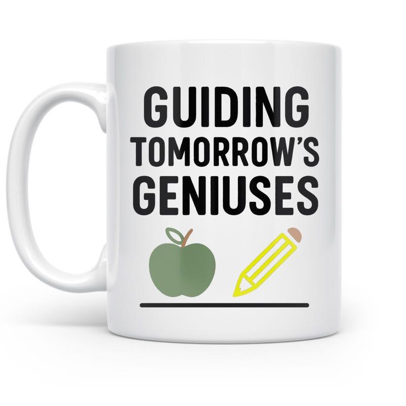 Tailorly White Ceramic 11 oz Mug - Guiding Tomorrow's Geniuses Minimalist Educational Theme Featuring A Green Apple And Yellow Pencil Mug