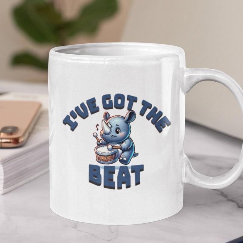 Tailorly White Ceramic 11 oz Mug - Ive Got The Beat Adorable Blue Cartoon Rhino Playing A Small Drum With Sticks Rhino