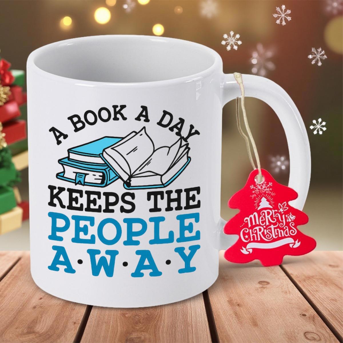 Tailorly White Ceramic 11 oz Mug - A Book A Day Keeps The People Away Open And Stacked Reading Materials On A Clean Minimalist Surface Books