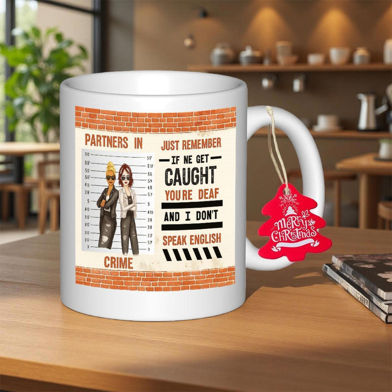 Tailorly White Ceramic 11 oz Mug - Partners In Crime Just Remember If We Get Caught Youre Deaf And I Dont Speak English Two Stylized Cartoon Women Posing Against A