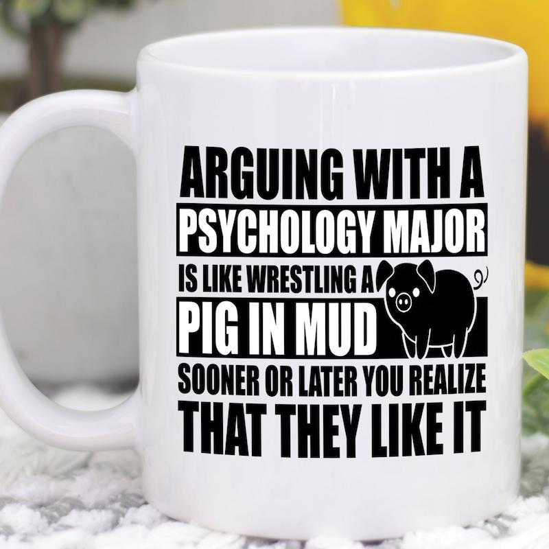 Tailorly White Ceramic 11 oz Mug - Arguing With A Psychology Major Is Like Wrestling A Pig In Mud Sooner Or Later You Realize That They Like It Simple Black