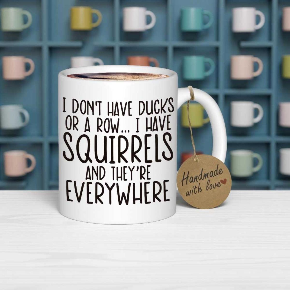 Tailorly White Ceramic 11 oz Mug - I Don't Have Ducks Or A Row I Have Squirrels And They're Everywhere Minimalist Ceramic Container With Bold Black Textual