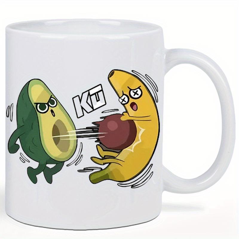 Tailorly White Ceramic 11 oz Mug - KU Angry Avocado Launching Seed Pit At A Defeated Yellow Banana Fruit
