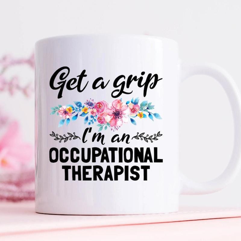 Tailorly White Ceramic 11 oz Mug - Get A Grip Im An Occupational Therapist Soft Pink And Blue Watercolor Flowers With Green Leaves Mug