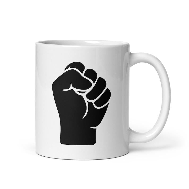 Tailorly White Ceramic 11 oz Mug - Strong Black Clenched Silhouette Symbolizing Power Unity And Resilient Solidarity Fist
