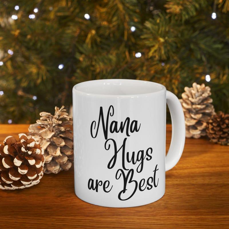 Tailorly White Ceramic 11 oz Mug - Nana Hugs Are Best Handwritten Black Calligraphy Lettering Centered On Smooth White Surface Mug
