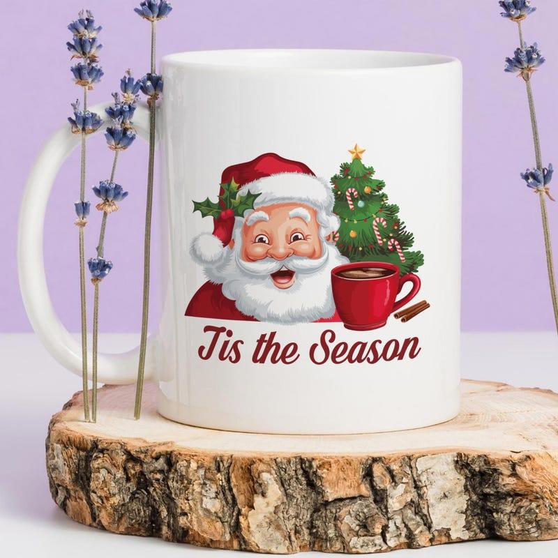 Tailorly White Ceramic 11 oz Mug - Tis The Season Jolly Santa Claus Beside Decorated Christmas Tree Holding Red Cocoa Mug