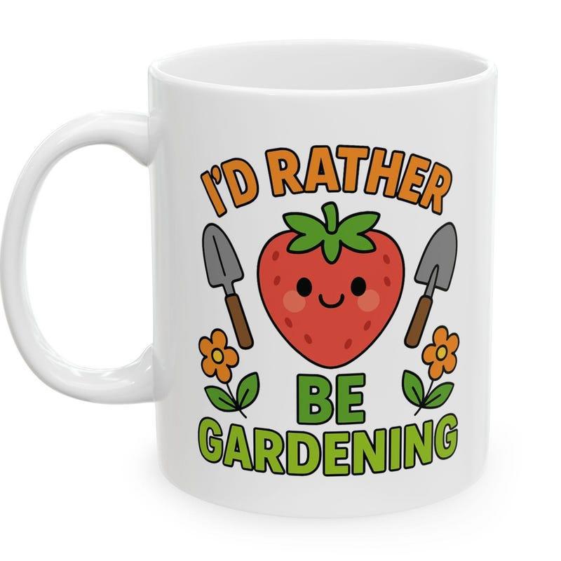 Tailorly White Ceramic 11 oz Mug - I'd Rather Be Gardening Cute Smiling Cartoon Fruit Flanked By Small Garden Trowels Strawberry