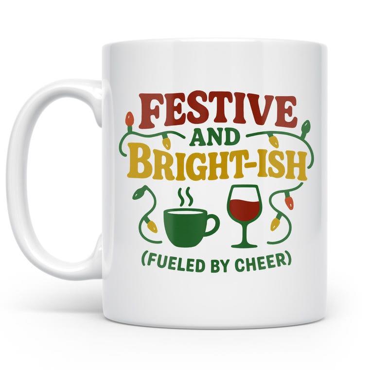Tailorly White Ceramic 11 oz Mug - Festive And Bright Ish Fueled By Cheer Festive Holiday Lights Hanging Near Coffee And Wine Mug
