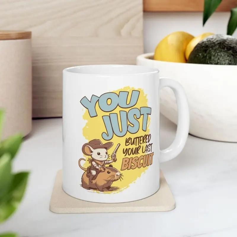 Tailorly White Ceramic 11 oz Mug - You Just Buttered Your Last Biscuit Little Cowboy Mouse Riding A Brown Capybara On Yellow Backdrop Mouse