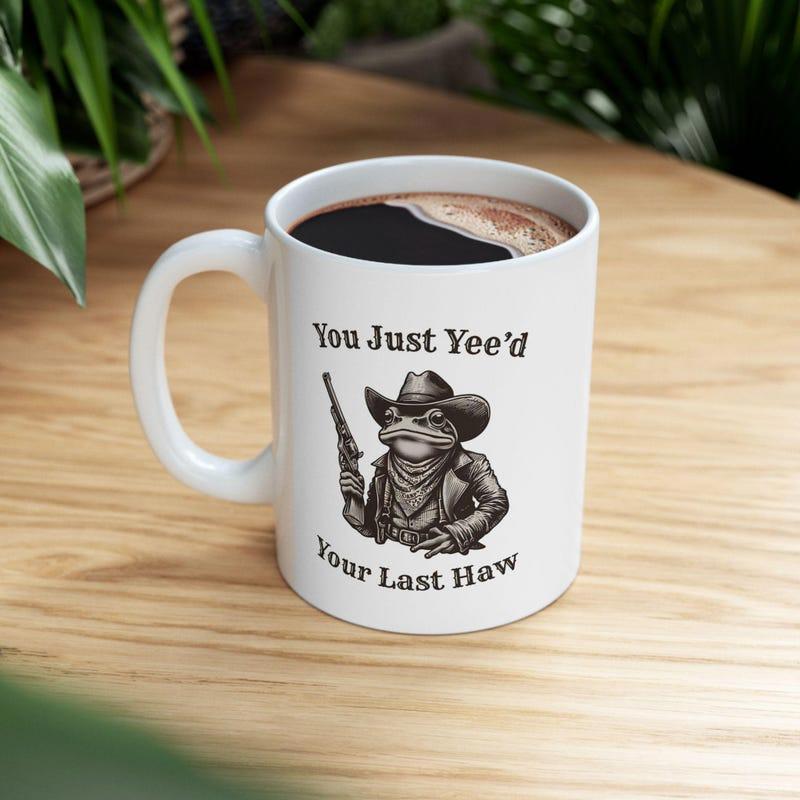 Tailorly White Ceramic 11 oz Mug - You Just Yeed Your Last Haw Vintage Style Illustration Of A Western Frog Wearing Cowboy Hat Holding Revolver Frog