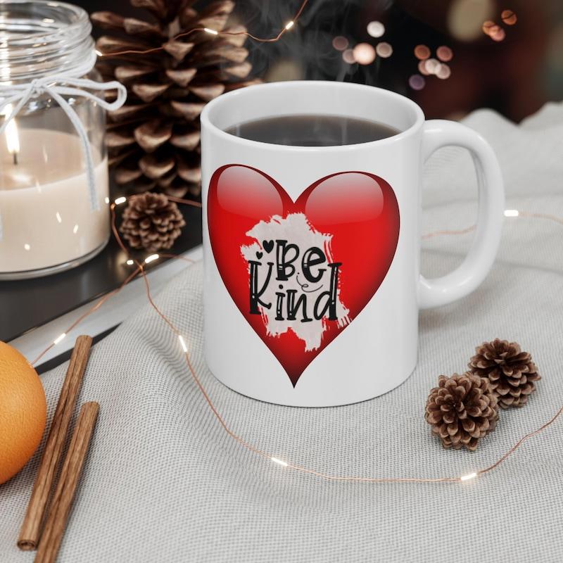 Tailorly White Ceramic 11 oz Mug - Be Kind Vibrant Glossy Red Symbol Featuring Stylized Artistic Script Within A Textured Center Heart