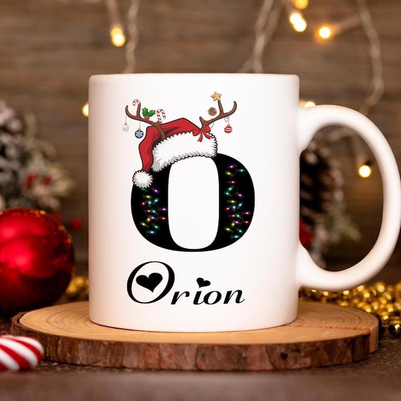 Tailorly White Ceramic 11 oz Mug - Orion Festive Christmas Themed Letter O With Reindeer Antlers And Santa Hat Mug