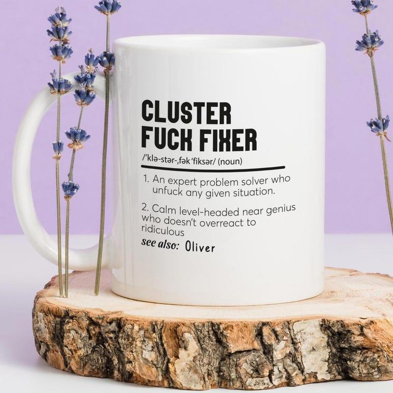Tailorly White Ceramic 11 oz Mug - Cluster Fuck Fixer Oliver Minimalist White Ceramic Vessel Sitting On Natural Wood Slice Mug