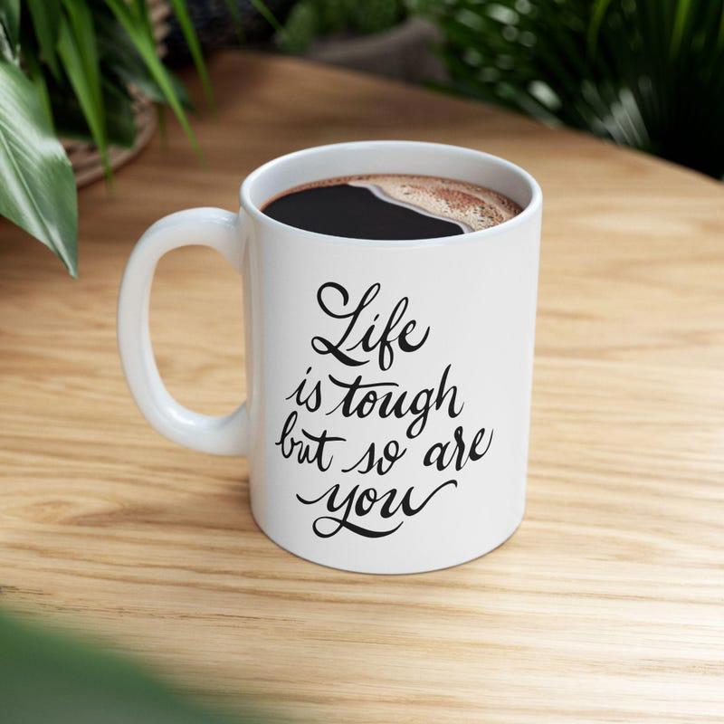 Tailorly White Ceramic 11 oz Mug - Life Is Tough But So Are You Minimalist Ceramic Vessel With Handwritten Motivational Quote On Smooth White Surface Mug