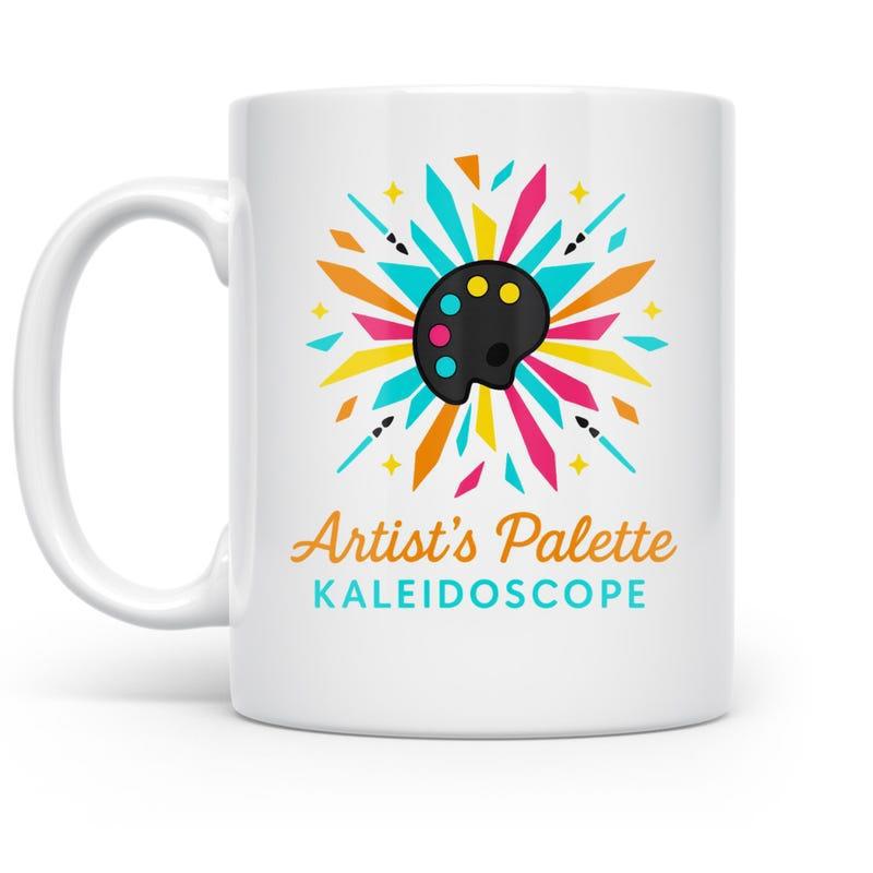 Tailorly White Ceramic 11 oz Mug - Artist's Palette Kaleidoscope Colorful Geometric Shards And Paintbrushes Surrounding A Classic Black Paint Palette
