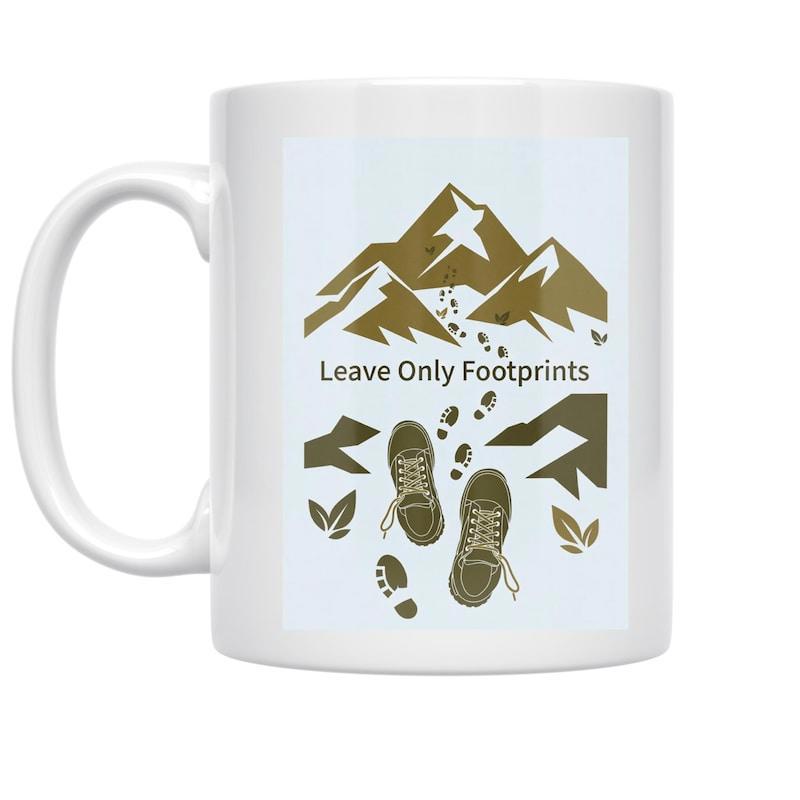 Tailorly White Ceramic 11 oz Mug - Leave Only Footprints Rugged Majestic Mountains Above Hiking Boots Tracking Across The Forest Trail Mountain