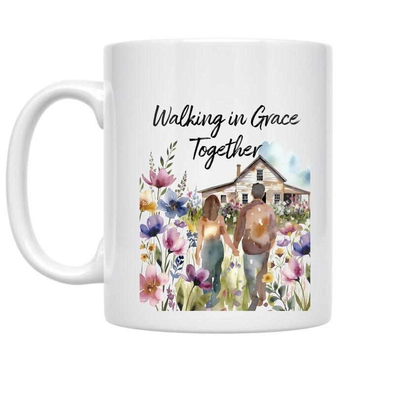 Tailorly White Ceramic 11 oz Mug - Walking In Grace Together Peaceful Garden With House And Beautiful Blossoms Surrounding A Couple