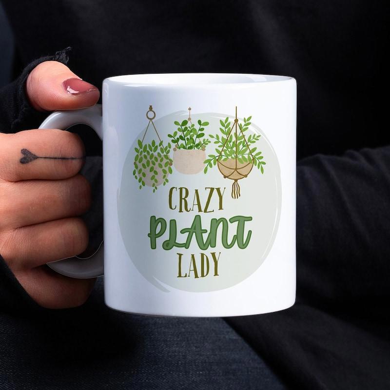 Tailorly White Ceramic 11 oz Mug - Crazy Plant Lady Lush Green Leaves Hanging In Woven Baskets Under Soft Light Plant