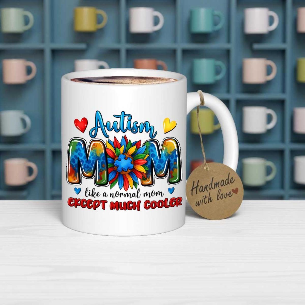 Tailorly White Ceramic 11 oz Mug - Autism Mom Like A Normal Mom Except Much Cooler Vibrant Colorful Puzzle Patterns Inside Text With A Central Petaled Sunflower