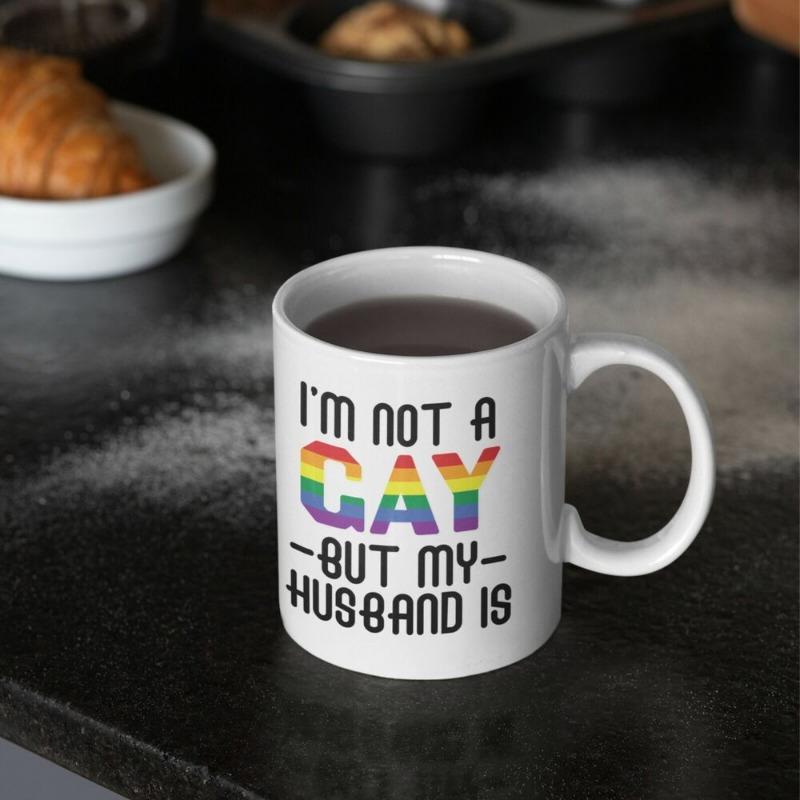 Tailorly White Ceramic 11 oz Mug - Im Not A Gay But My Husband Is Minimalist Displayed On A Dark Kitchen Counter Mug