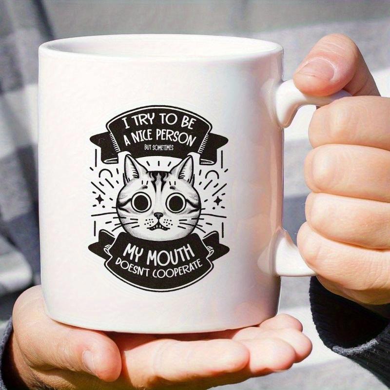 Tailorly White Ceramic 11 oz Mug - I Try To Be A Nice Person But Sometimes My Mouth Doesnt Cooperate Cartoon Cat Illustration With Big Eyes Nestled Between Two
