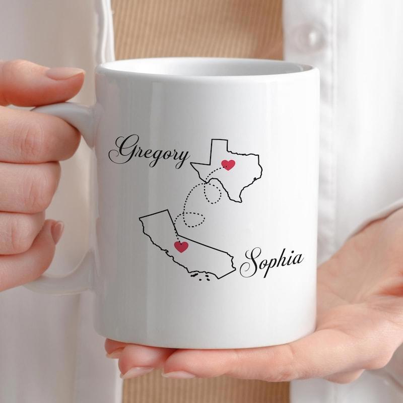 Tailorly White Ceramic 11 oz Mug - Gregory Sophia Two US States Connected By Dotted Line And Hearts Map