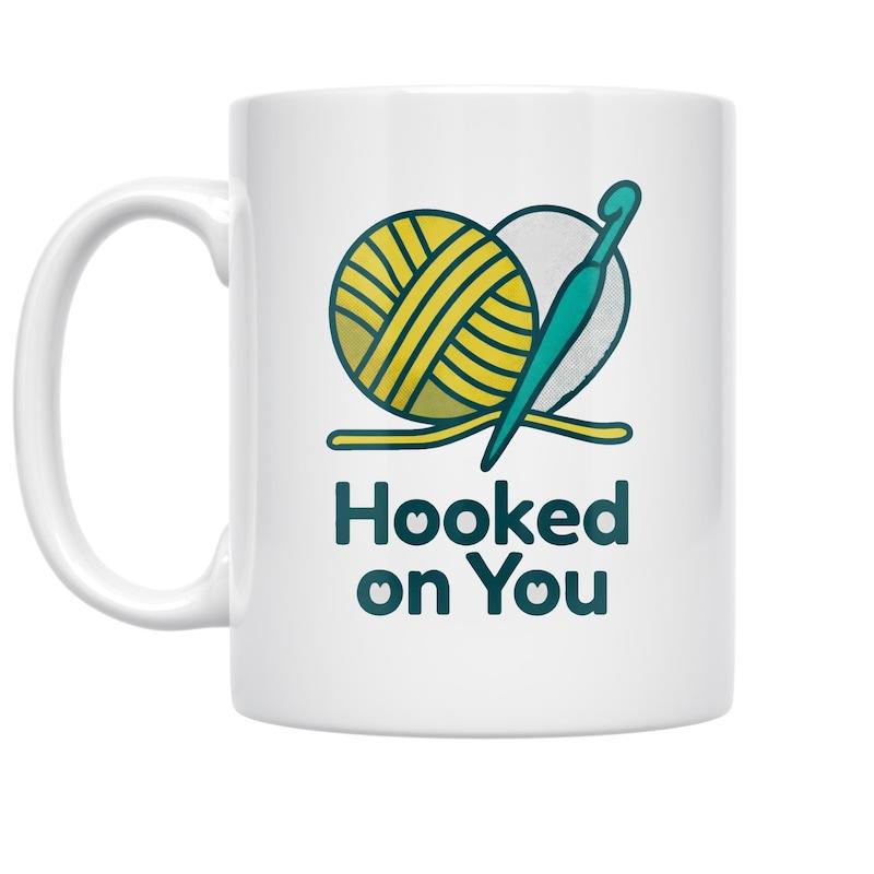 Tailorly White Ceramic 11 oz Mug - Hooked On You Vibrant Yellow Yarn Ball And Teal Crochet Hook With Heart Pattern
