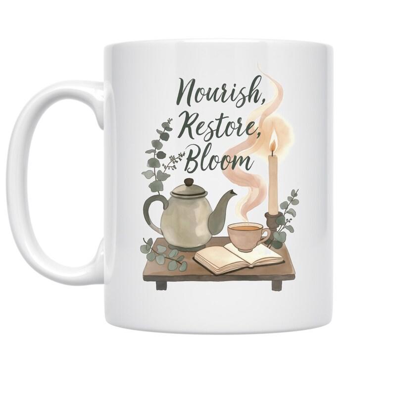 Tailorly White Ceramic 11 oz Mug - Nourish Restore Bloom Cozy Teatime Scene With Open Book Lit Candle And Eucalyptus Branches Mug
